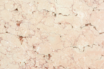 Light beige background with marble texture. Plate of natural stone with veins.