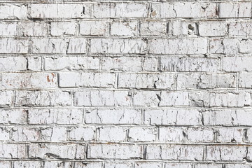 Old wall made of red brick, painted white in loft style for modern designer interior of room, bar or restaurant