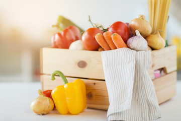 cooking, vegetarian food and healthy eating concept - close up of wooden box of fresh ripe vegetables