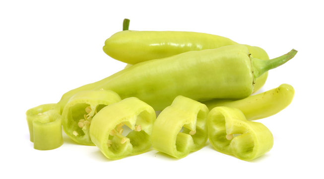 yellow banana peppers and slice on white background.