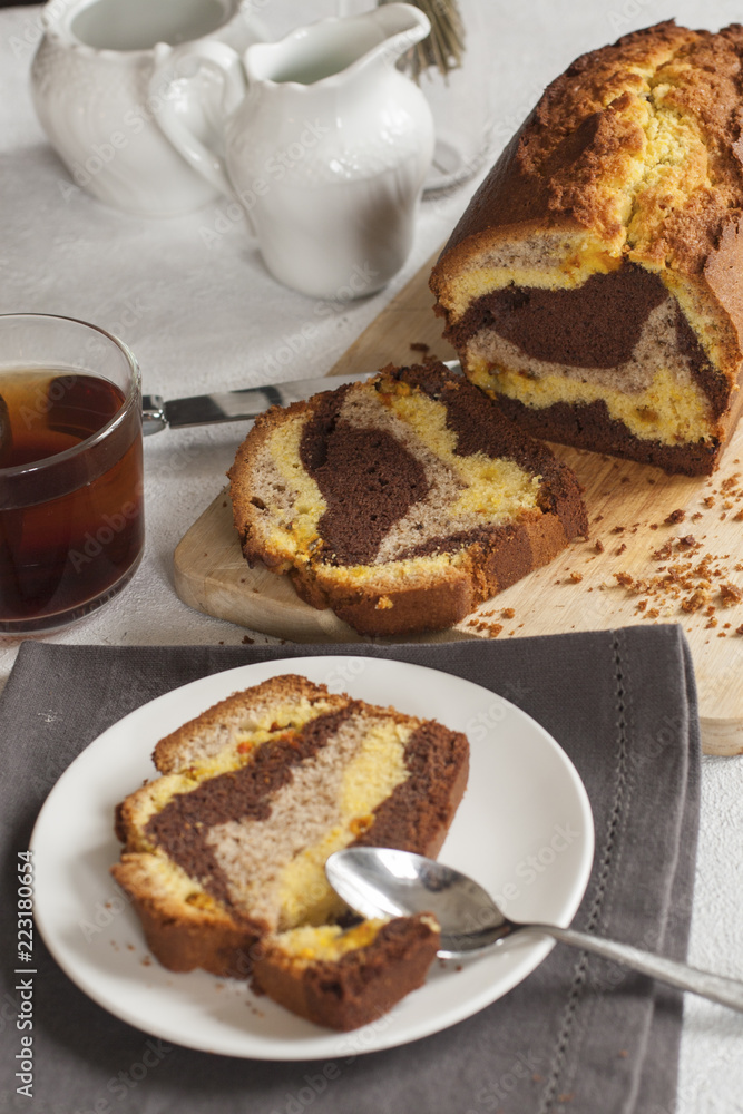 Canvas Prints Homemade marble plum cake, three colours made with saffron, walnuts and chocolate.