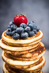 Fresh berry fruits on pancakes