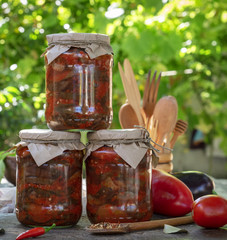 jars with rolled marinated pieces of eggplant in vegetable sauce © nndanko