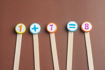 mathematics Toy Numbers on Brown Background.