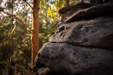 rocks against the blue sky and forest
