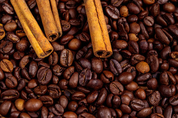 Roasted coffee beans and cinnamon sticks