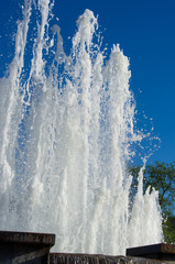 Fountain in city park on hot summer day