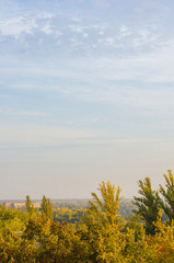 Fototapeta premium Autumn landscape with colorful trees in sunlight