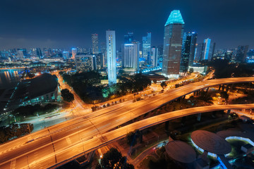 Fototapeta na wymiar Singapore city skyline. Aerial view to illuminated city at night