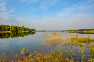Artificial lake formed after the removal of sand. Closed sand quarry.