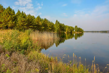Artificial lake formed after the removal of sand. Closed sand quarry.