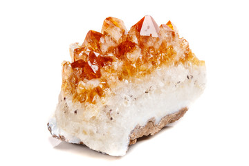 Macro mineral stone Citrine in rock in crystals on a white background