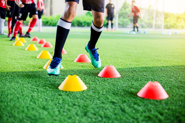 Kid soccer player moving speed test and Jogging and jump between marker