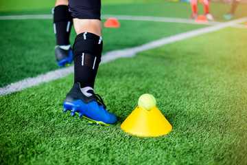 Kid soccer player moving speed test and Jogging and jump between marker