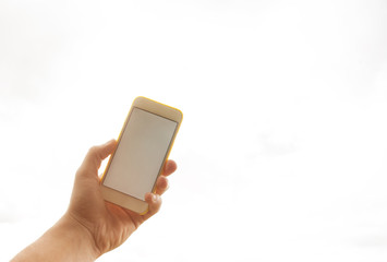 a man is holding a phone with a white screen