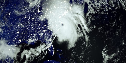 Extremely detailed and realistic high resolution 3D illustration of a Hurricane at Night hitting the US East Coast. Shot from Space. Elements of this image are furnished by Nasa.