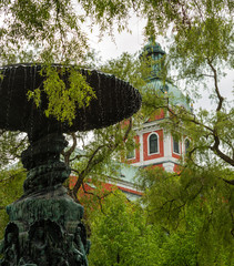 Church behind fountain in kungstradgarden stockholm