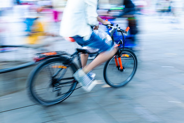 bicycle rider in the city in motion blur