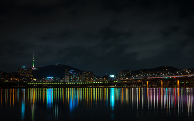 Bridge with colorful lights and N Seoul Tower in the background