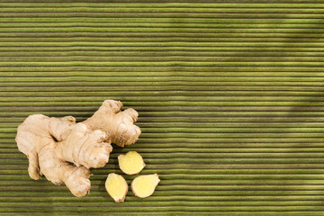 Ginger root on wooden table - Zingiber officinale