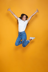 Full length portrait of a cheerful girl with long dark hair
