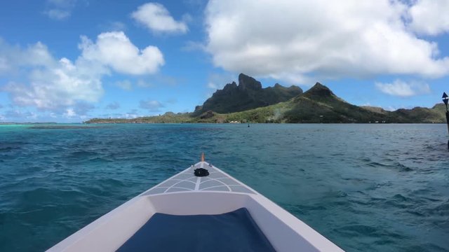 Sailing around blue lagoon and Otemanu mountain at Bora Bora island, Tahiti, French Polynesia (view from action camera)

