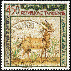 Ancient mosaic of gazelle on postage stamp of Tunisia