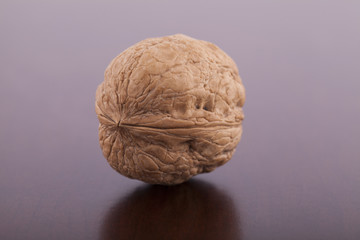 Fototapeta premium Walnut on wooden background close up