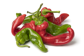 Heap of natural shaped organic red and green fresh pointed bell peppers