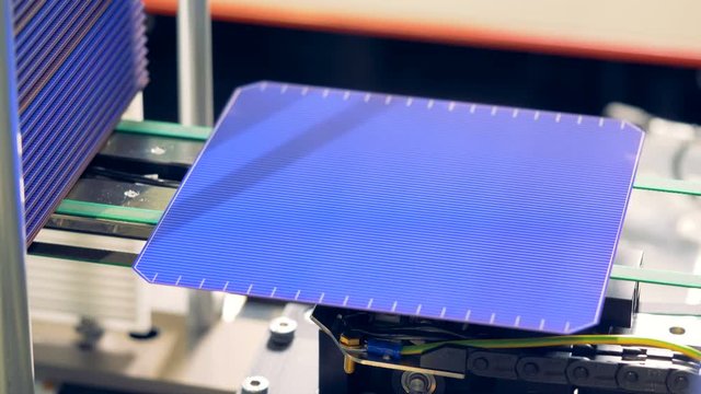 Solar module cells being released and moving along the conveyor belt. Innovative production concept.