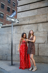 Women Getting Directions on Street Sidewalk