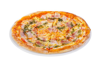 Pizza with sauce, pesto, basil, ham, bacon, whole round, cut into pieces, on a white isolated background. Fast food in a pizzeria, a floury cheese product. Side view