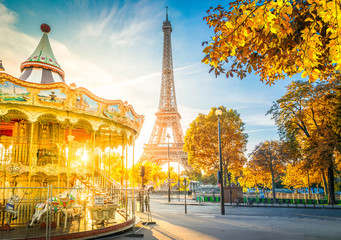 Eiffel Tower with merry go round from Trocadero at fall sunrise, Paris, France, toned - obrazy, fototapety, plakaty