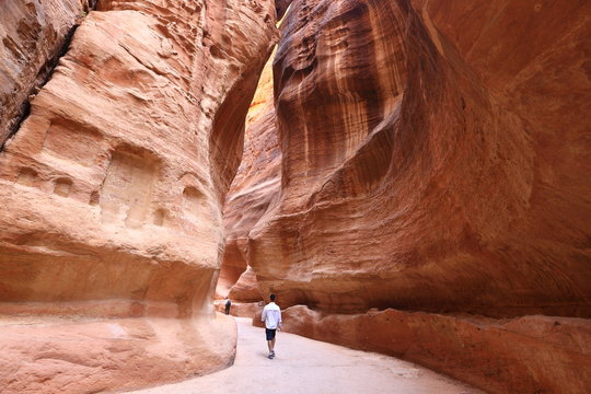 The Siq, the narrow slot-canyon that serves as the entrance passage to the hidden city of Petra, Jordan 