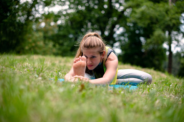 Young female doing physical relaxation exercise