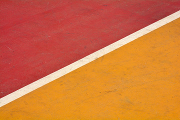 Fototapeta premium closeup yellow and red basketball court