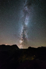 Milky way galaxy stars over the Alps, Mars and Jupiter planet, snowcapped mountain range, astro...