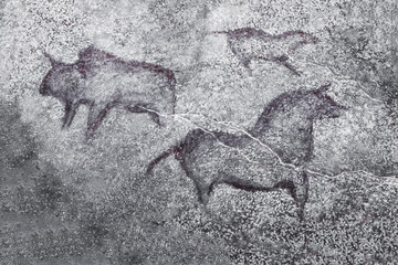 An image of ancient animals on a cave wall painted by an ancient man. history of antiquities, archeology.
