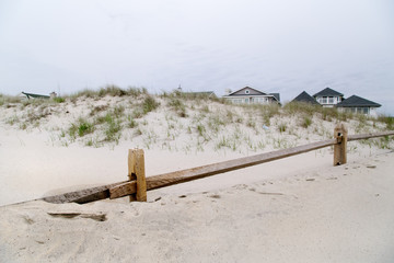 Atlantic ocean beach in the morning. Wooden fence. Sand. Atlantic ocean,NJ. 
