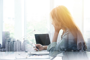 business office girl playing smartphone with overlay metro building to connect people concept