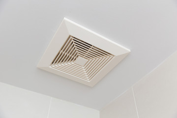 Air ventilation moisture duct in bathroom pipe hole at ceiling.