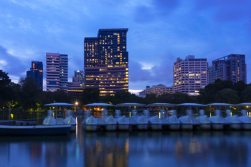 Bangkok city view from Lumpini Park at dusk.