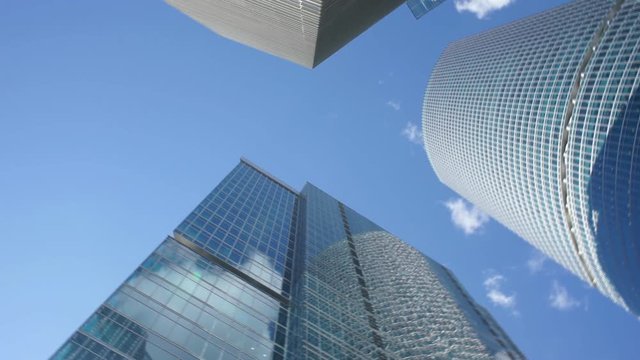 Slow circular motion of camera among skyscrapers