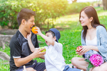 Asian teen family happy holiday picnic moment in the park