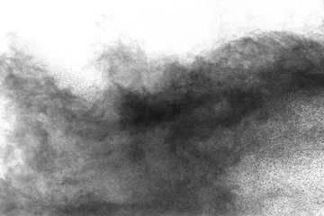 Black powder dust explosion against a white background.