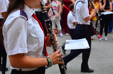 Street musicians play folk music at city square.
