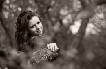 Beautiful young girl walking in spring Park