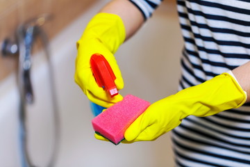 Hands with cleaning accessories