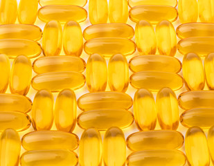 capsules Omega 3 from fish oil on a white background. Texture