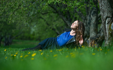 Beautiful young girl walking in spring Park